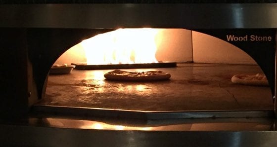 Open flame wood pizza oven used everyday at 360 American Bistro and Bar at Melia Orlando Suites Hotel in Celebration