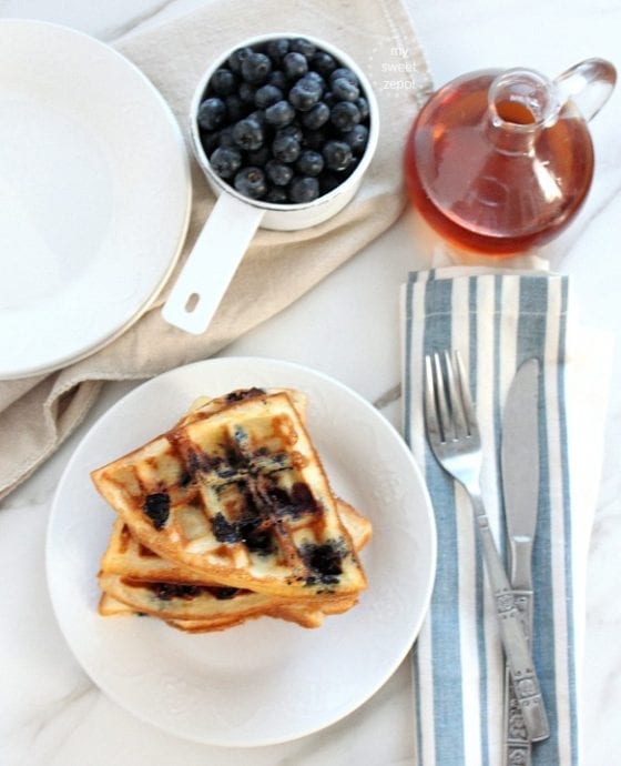 Blueberry Belgian Waffles are sweet, tangy, light, airy and the perfect brunch meal. Or for dinner too, why not! more at mysweetzepol.com