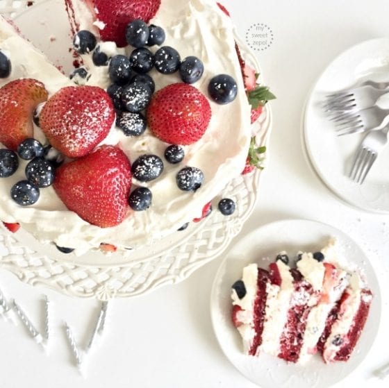 Cut a slice of a Red Velvet, Berries and Cream Layer Cake and celebrate today. recipe found at mysweetzepol.com 