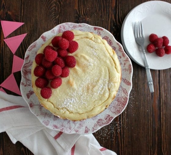 The Best Dairy Free Cheesecake topped with fresh raspberries