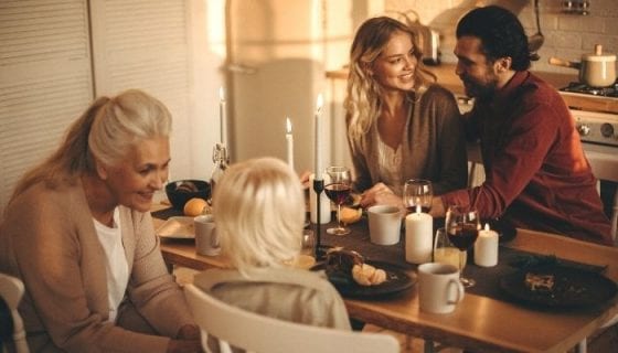 Family gathered enjoying Thanksgiving leftover food during Black Friday. 