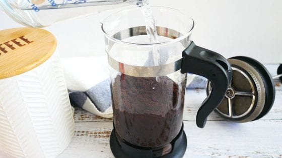 cold brew coffee made in a french press, white coffee canister